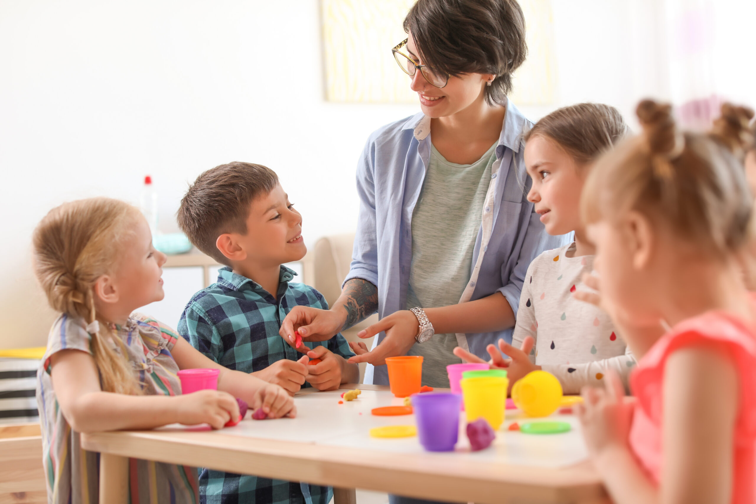 Teacher with young students.