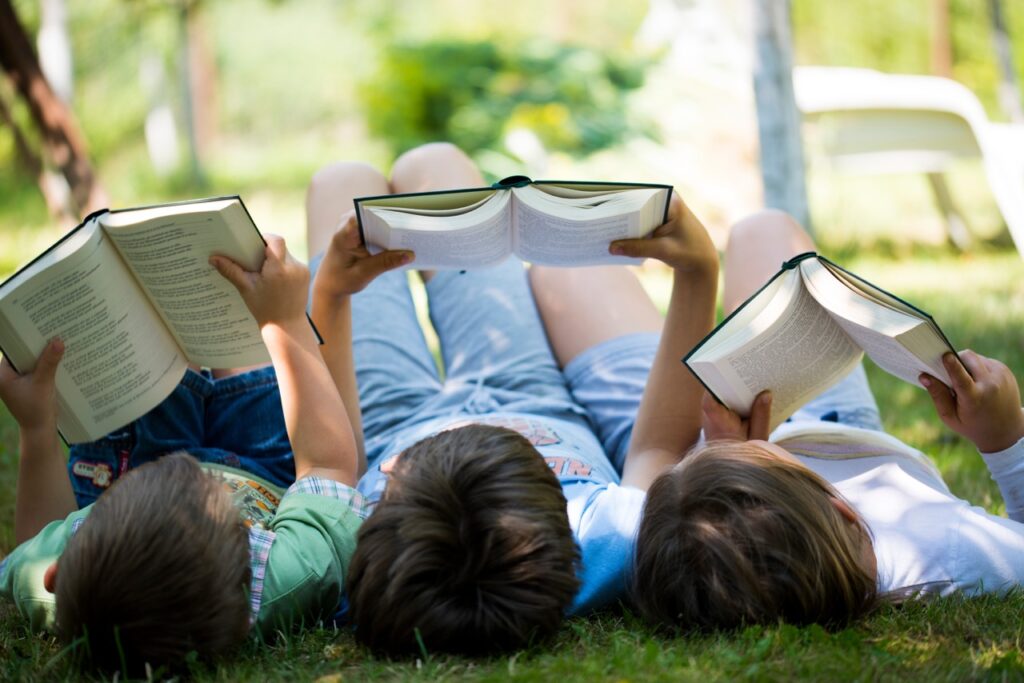 Children Reading Outside