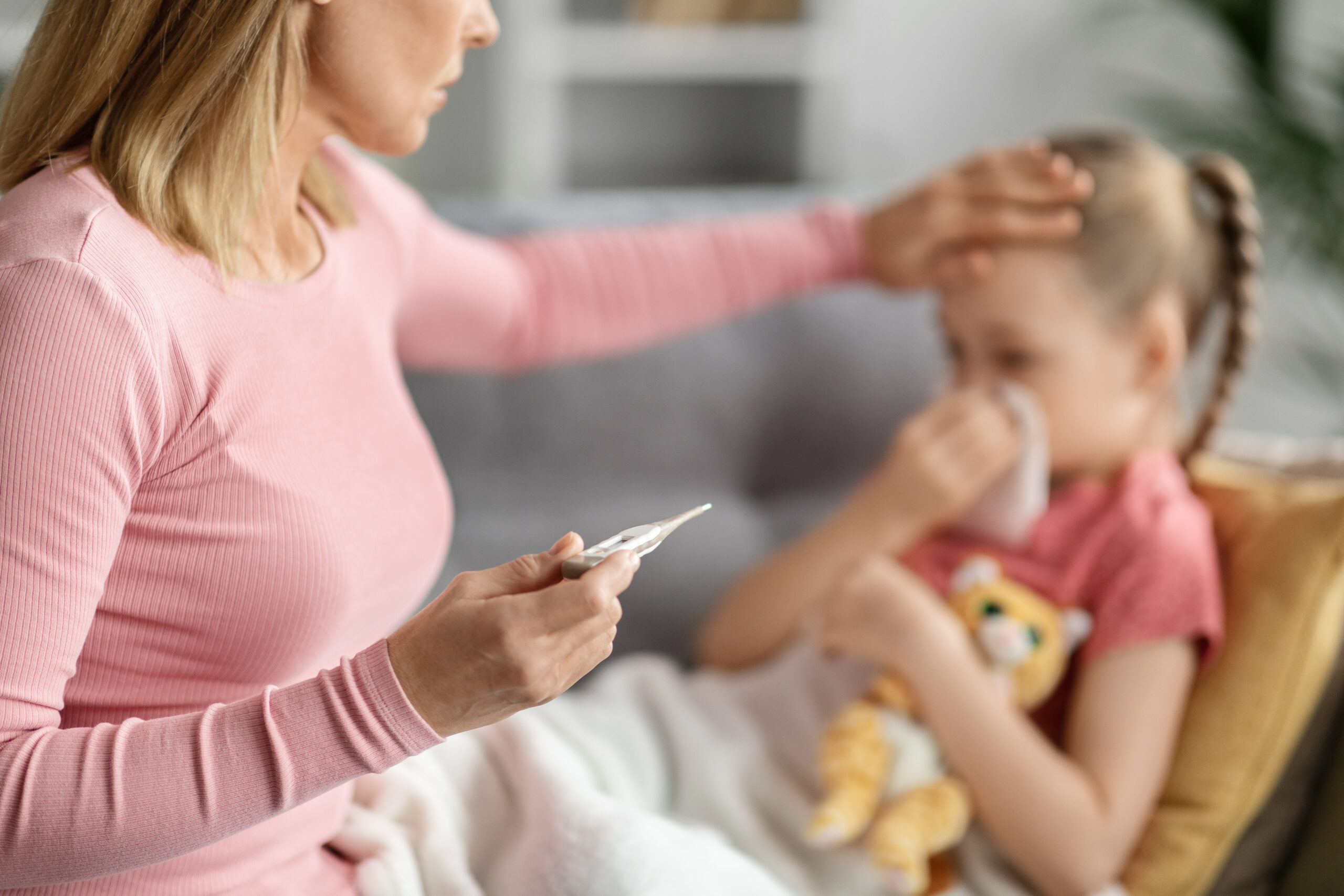 Mom checking on sick child