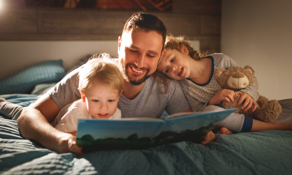 Dad reading to children
