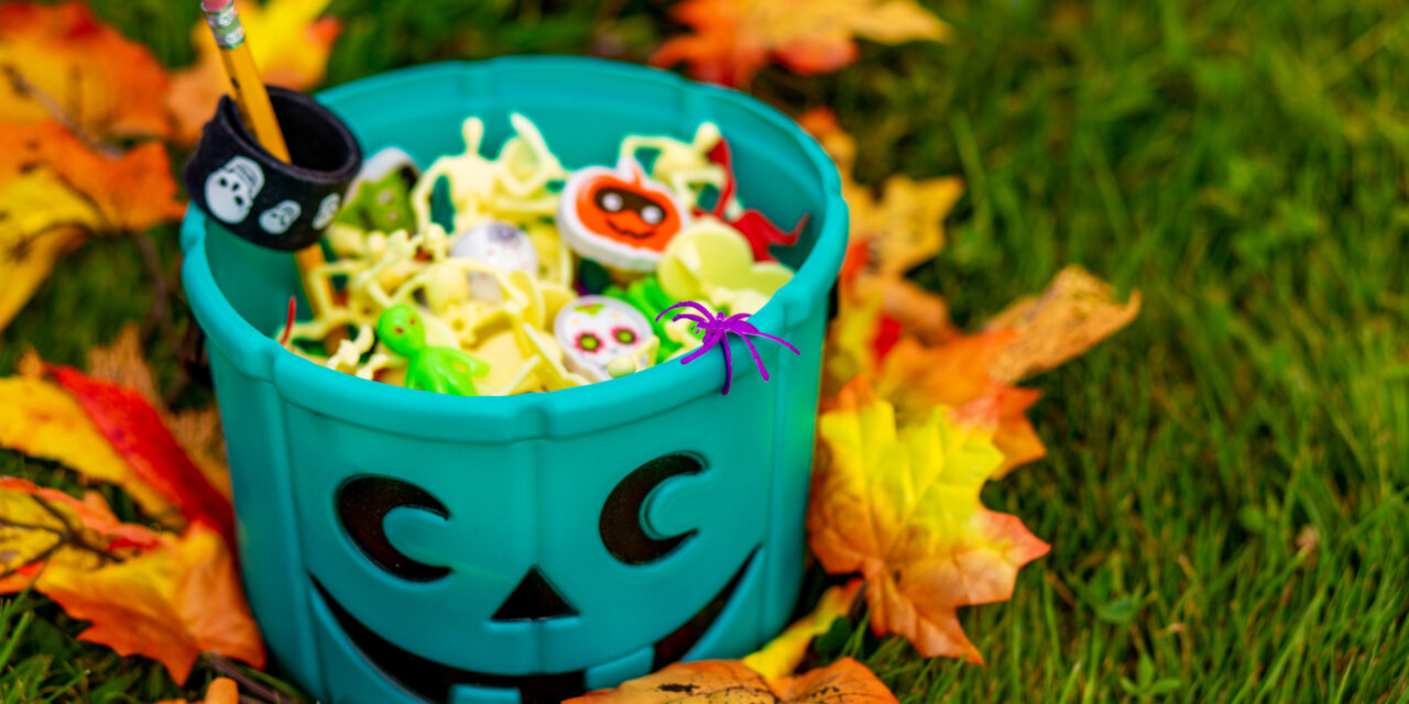 teal bucket with Halloween trinkets outside. trick or treating. Halloween Allergy Friendly Trick or Trinket, Teal Pumpkin Project layered 4th of July Jello