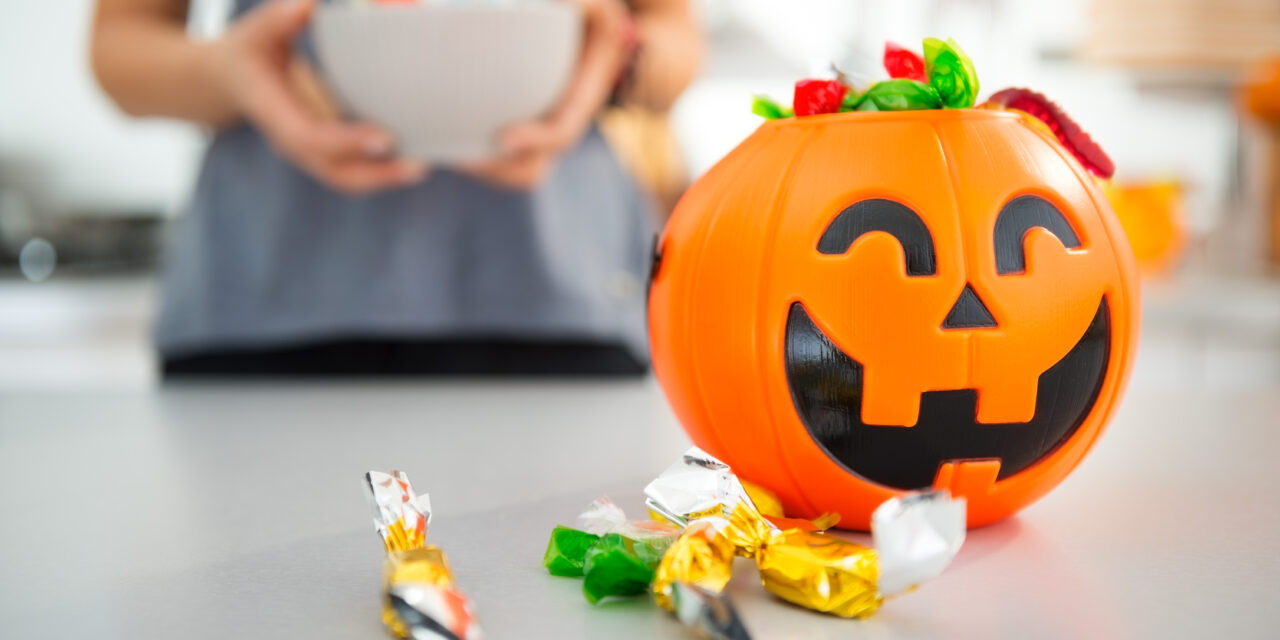 Closeup on halloween bucket full of trick or treat candy layered 4th of July Jello