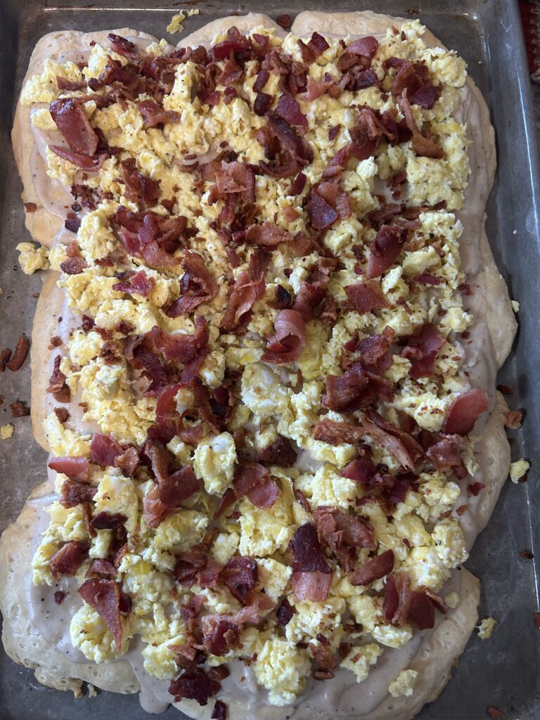Breakfast Piiza with gravy, eggs, and bacon