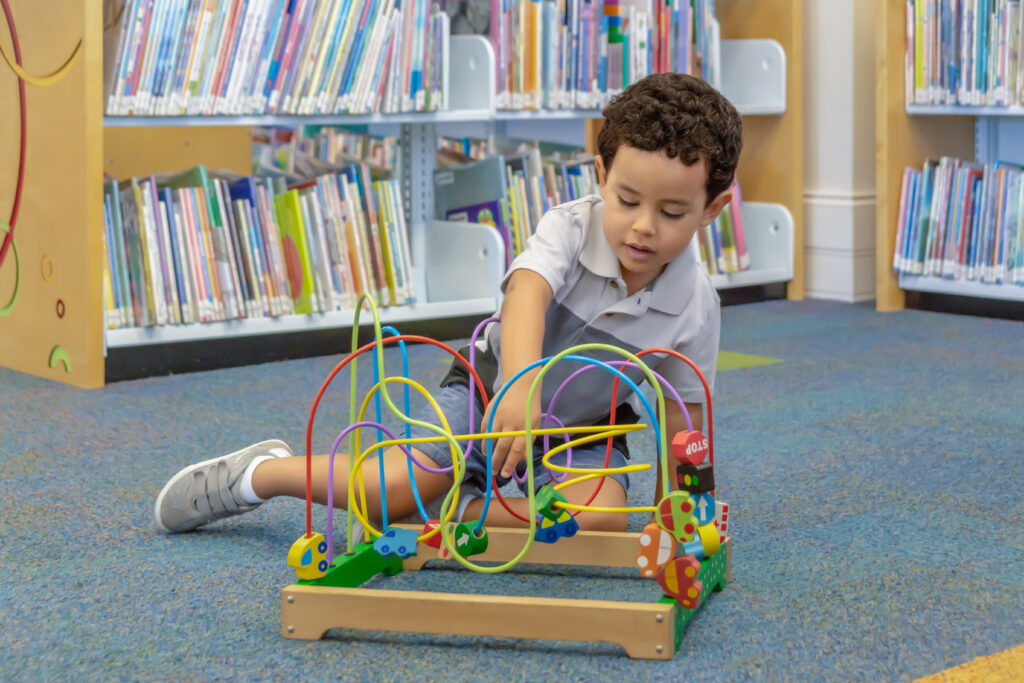 Toddler Playing at a free Library