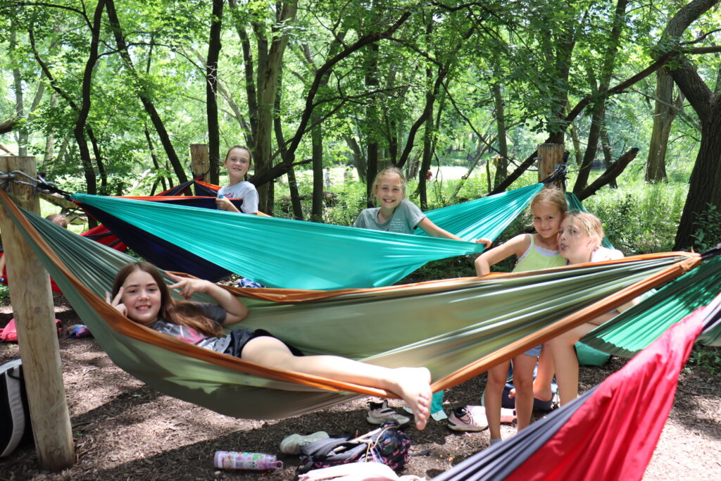 Girls in hammocks at camp leif ericson